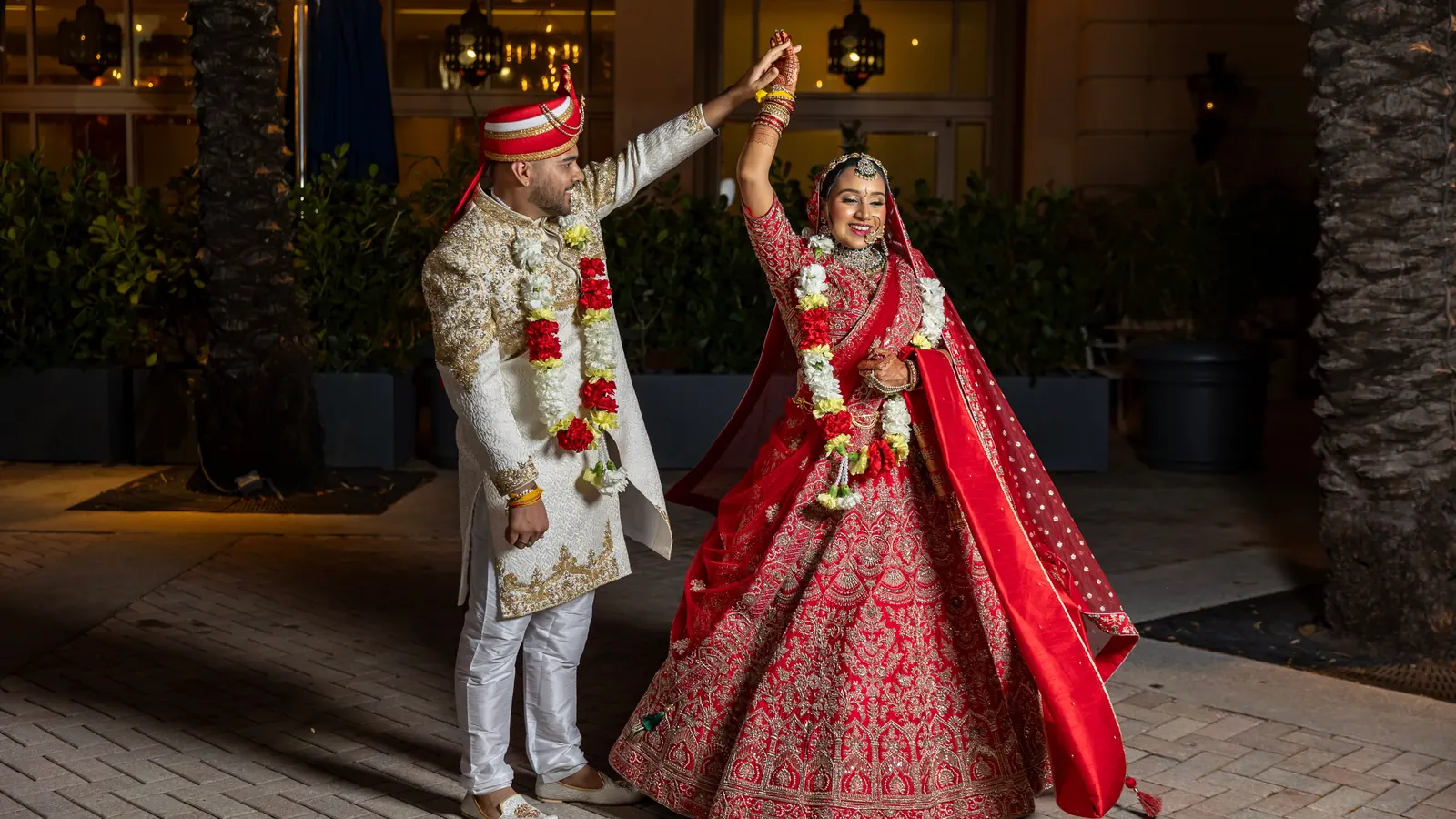 A couple dancing at a wedding at night