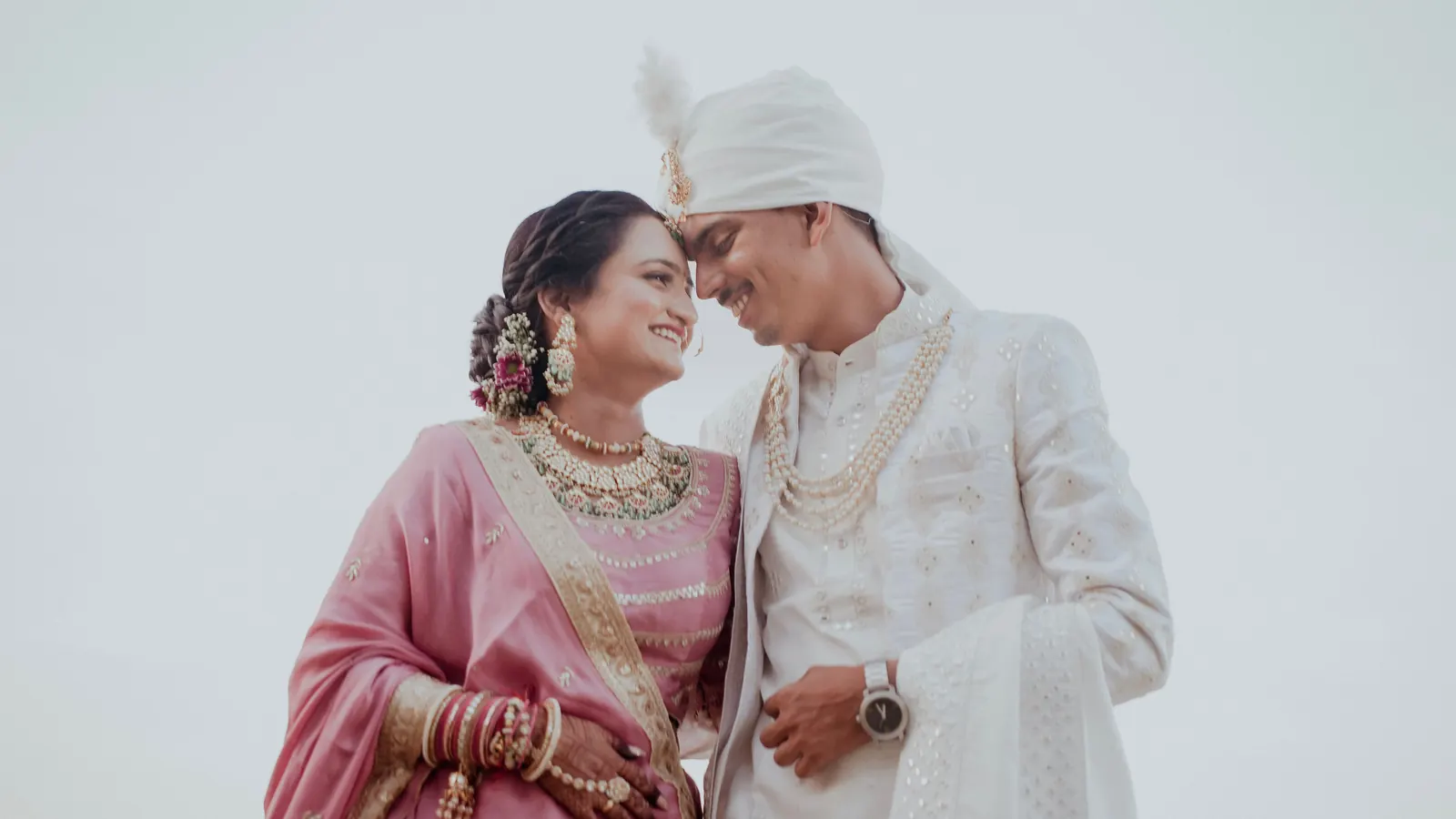 A couple at their wedding, photographed by a studio using Photo Sathi