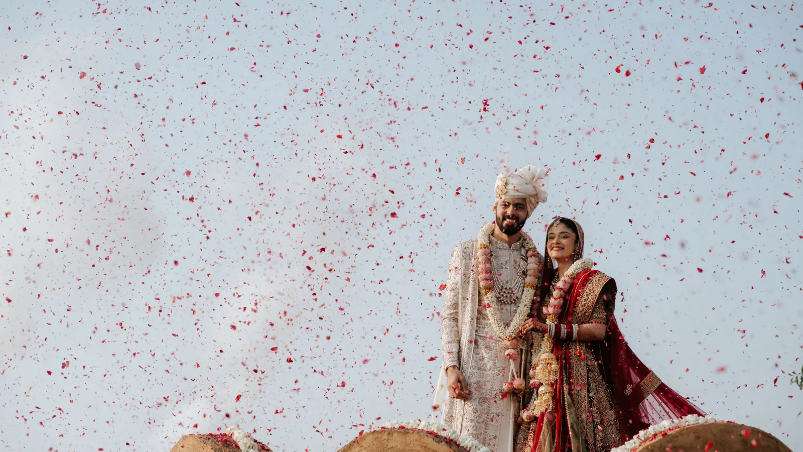 Flower petals thrown over a couple at an Indian wedding